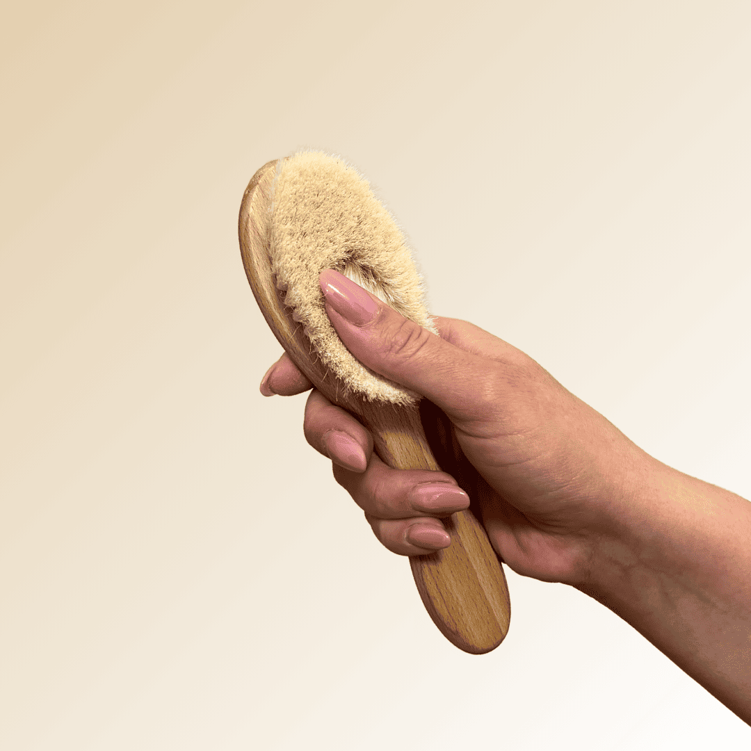 glowytouch facial brush in hand