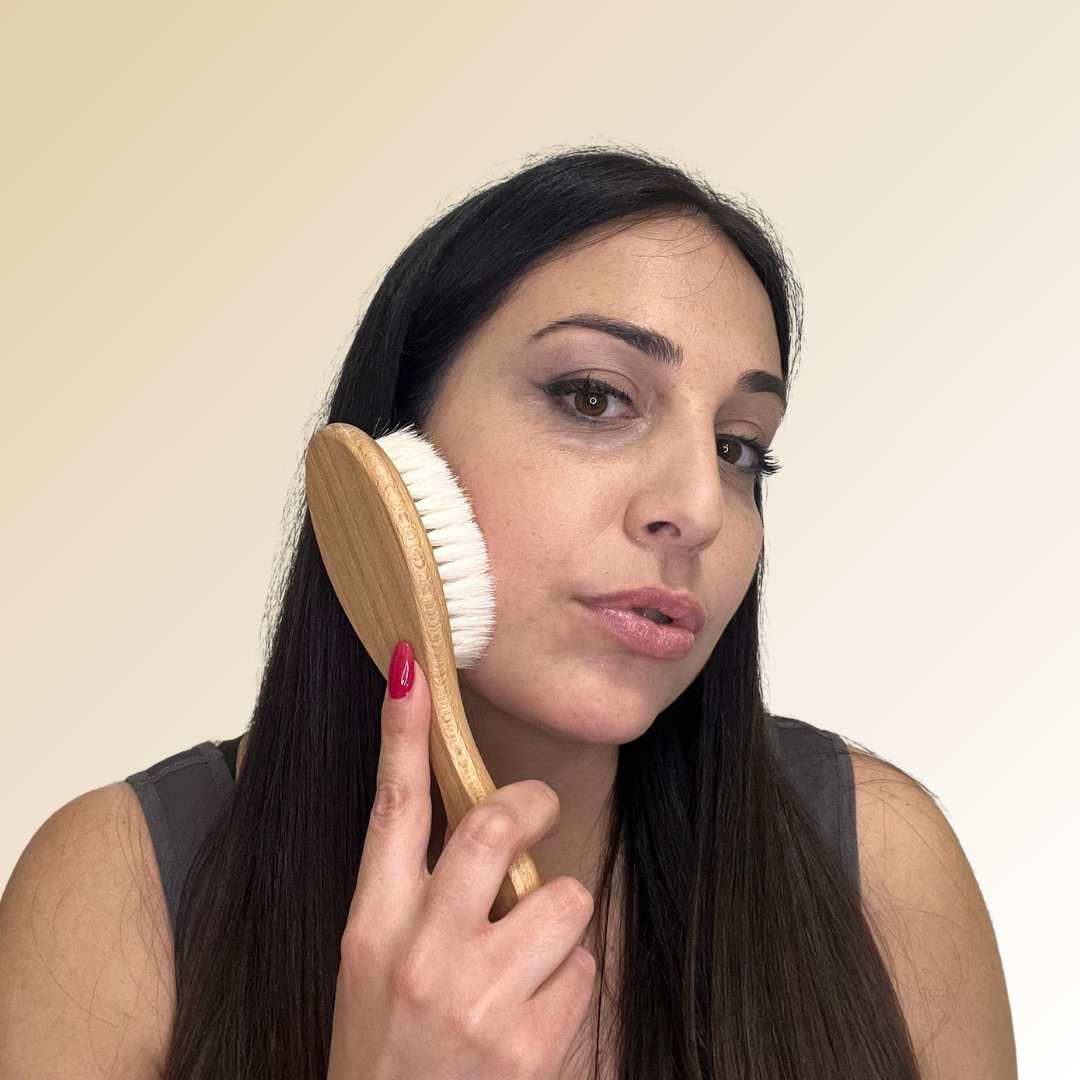 model with glowytouch facial brush